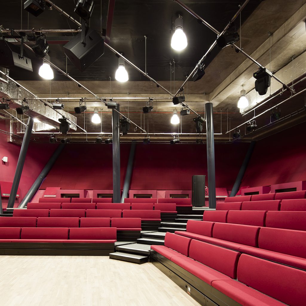 Theatre space with red bench seats
