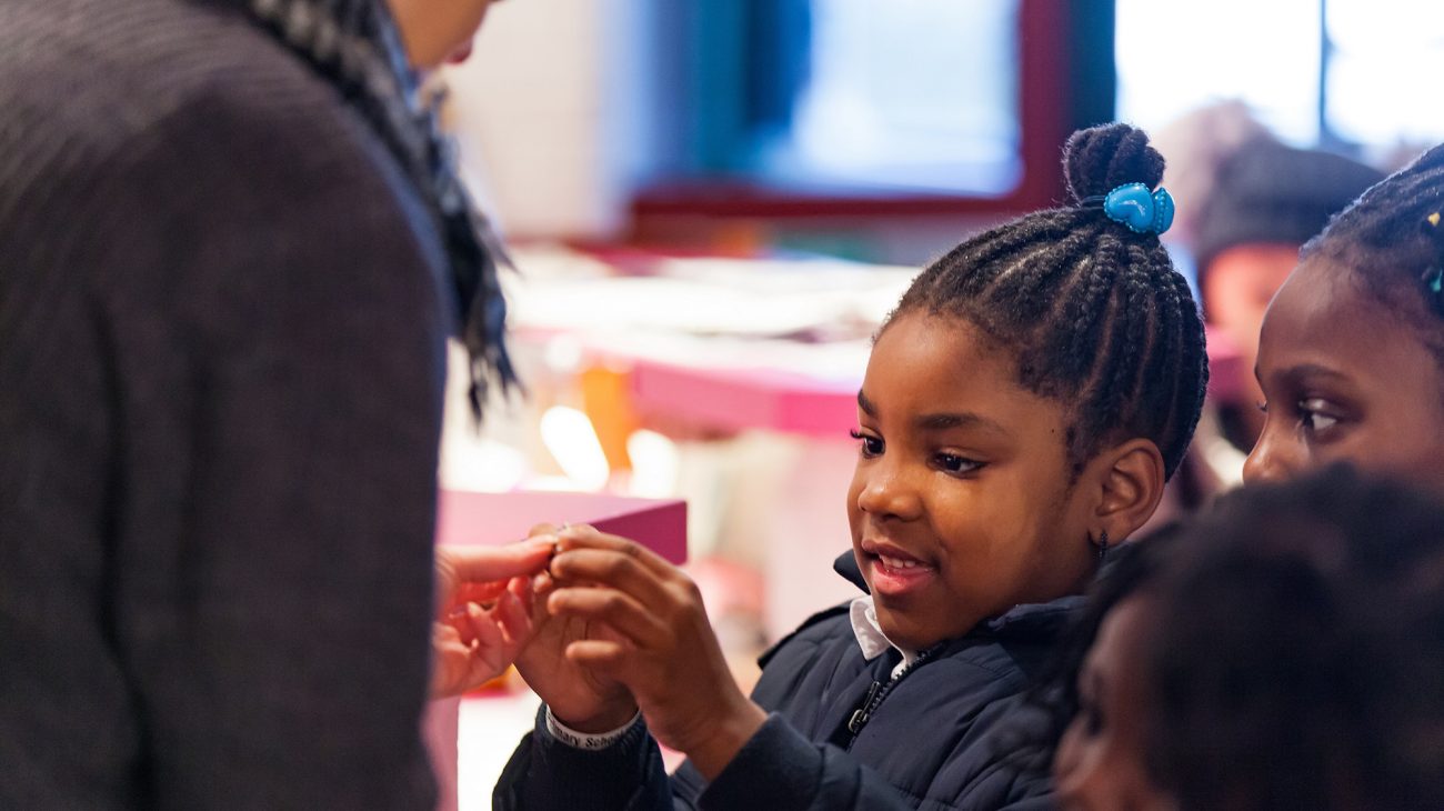 A child from Childeric School at the Albany getting ready to watch tutti frutti's 'The Ugly Duckling' as part of Every Child. Photo Chris Marchant