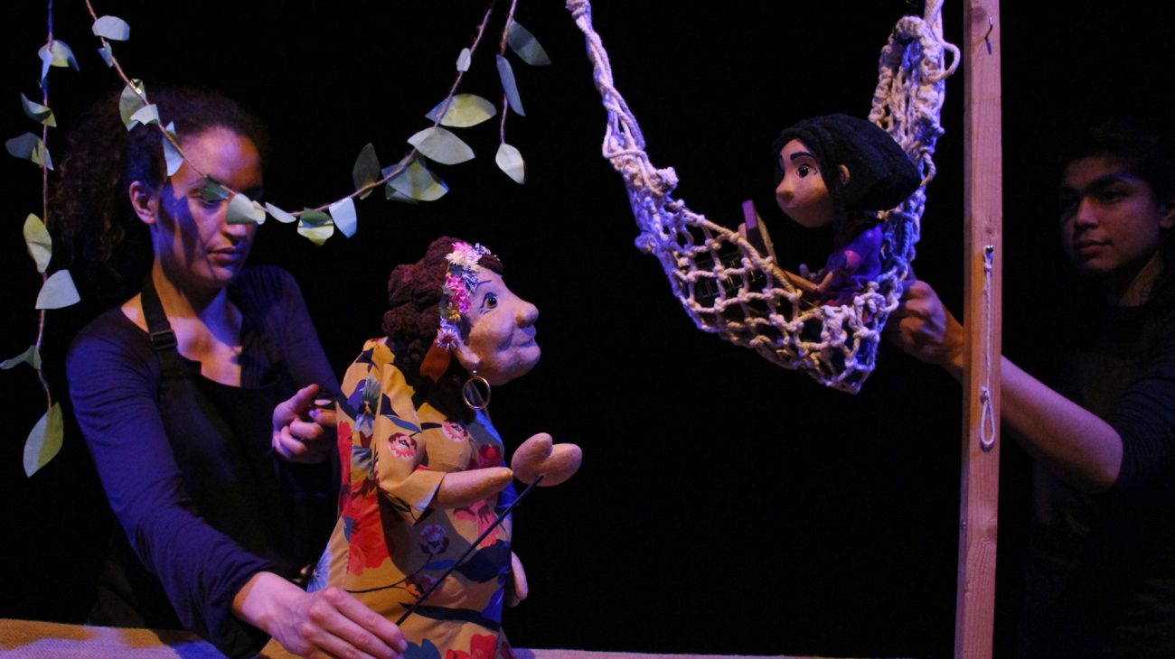 Jacina in a hammock with her grandma. Stories on a String production shot.
