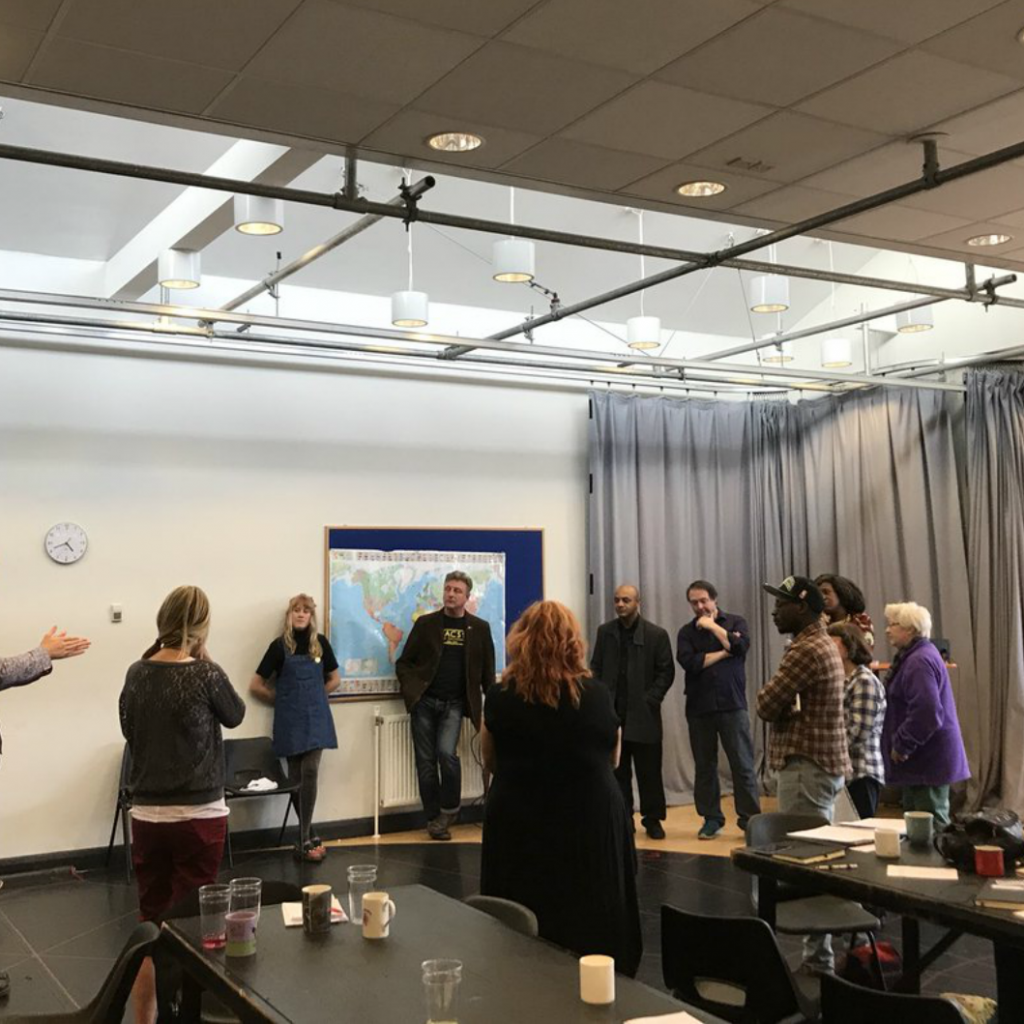 A group of people talking in a room
