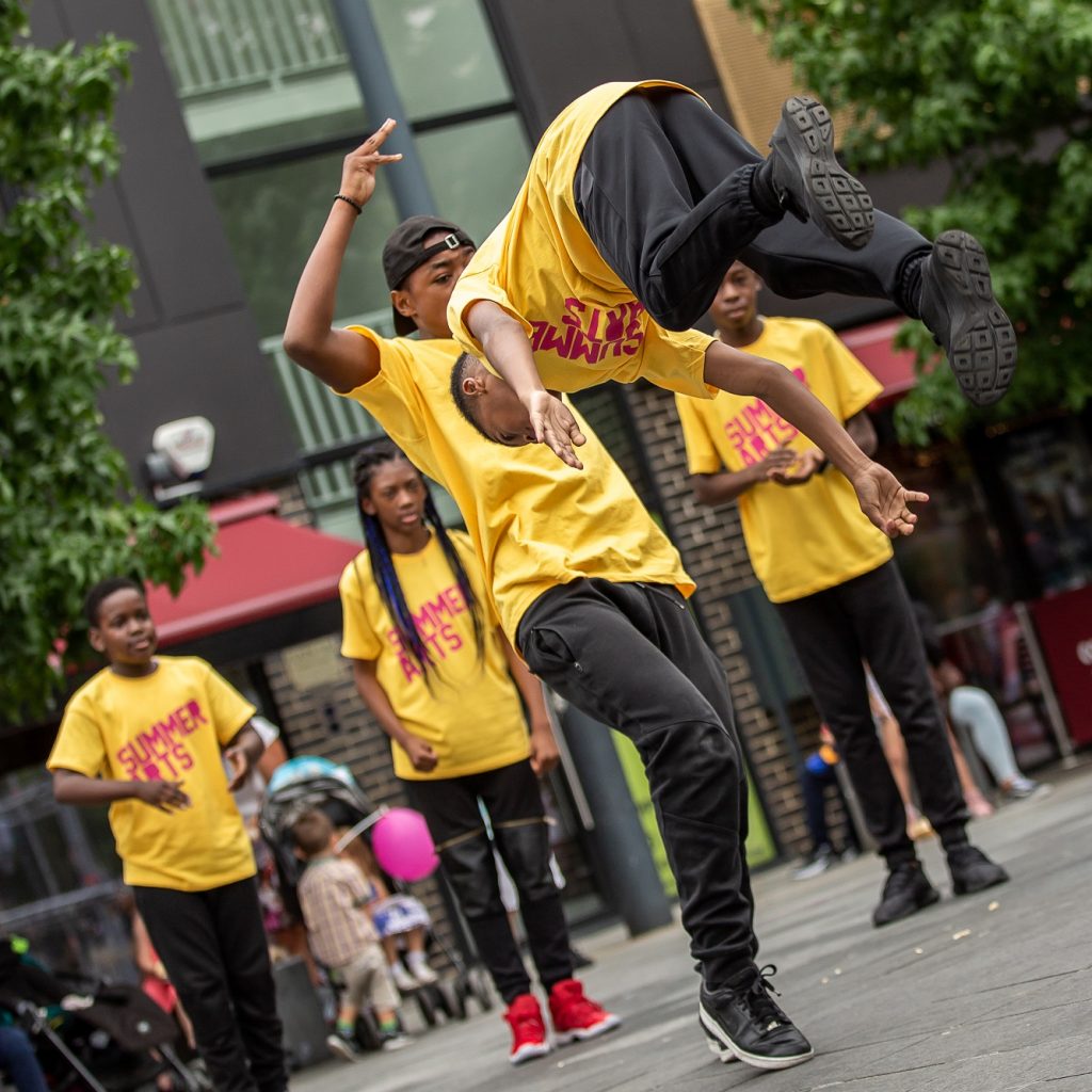 Image of a young boy doing a front flip.