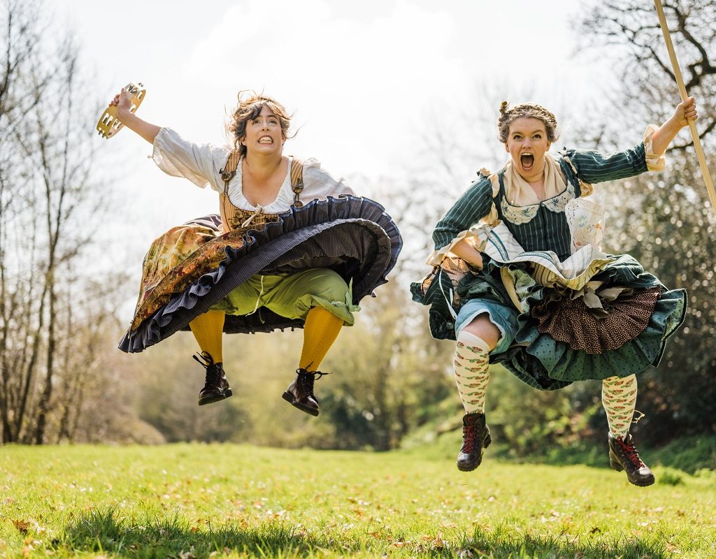 Two white women in mid air and making faces